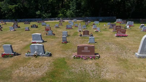 Drone Shot Panning Right of Small Town U.S. Cemetery Royalty Free Stock Drone Video Footage