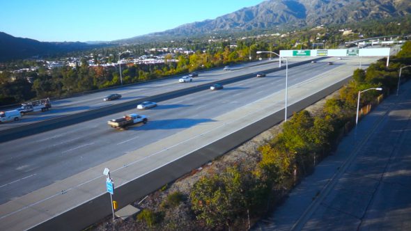 Freeway Pan With Mountains Royalty Free Stock Drone Video Footage