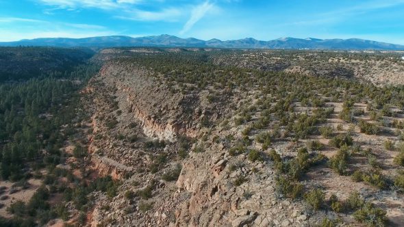 Ascending Flight from the New Mexico Canyon Cliffs Royalty Free Stock Drone Video Footage