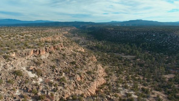Reverse Flight Along the New Mexico Canyon Cliffs Royalty Free Stock Drone Video Footage